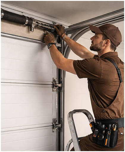 Technician repairing garage door system